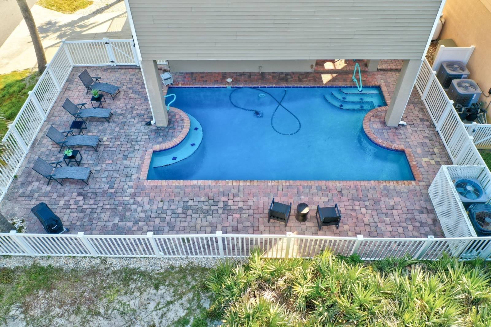 Top-down aerial of the saltwater pool and patio